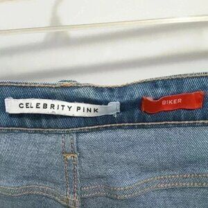 Celebrity pink distresed denim biker shorts